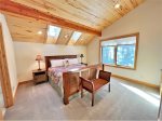 2nd fl. King Ensuite feels like a treehouse with sky lights, windows and enchanting forest views